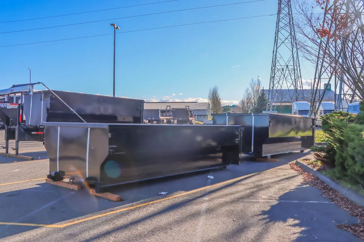 Roll-off dumpster ready for waste disposal at job site for Demolition Dumpster Rental in Lower Oxford